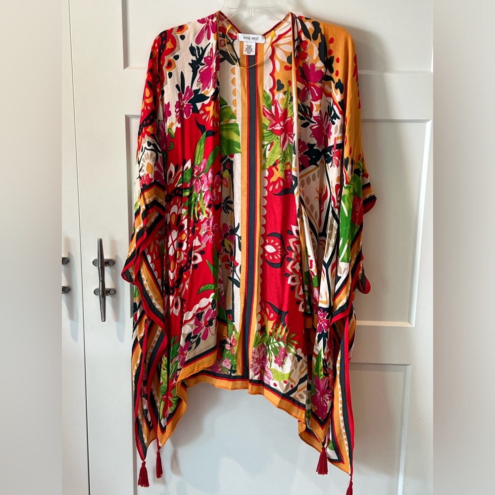 Beautiful tropical shrug with vibrant colors. One size fits all.